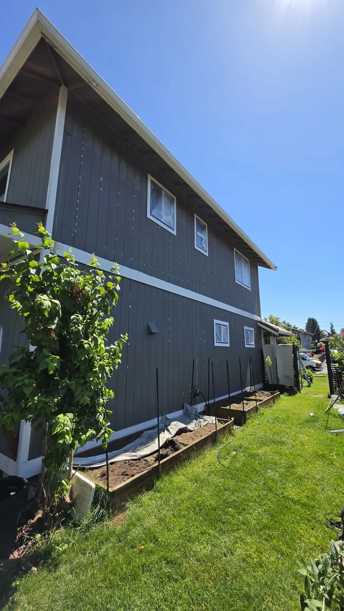 Before side elevation and siding condition