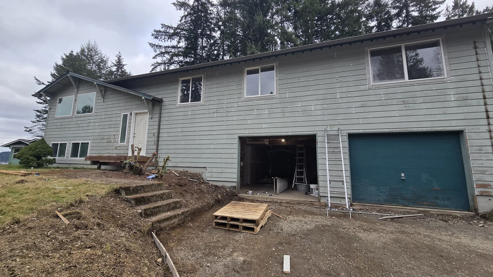 Before exterior siding and garage-facing elevation