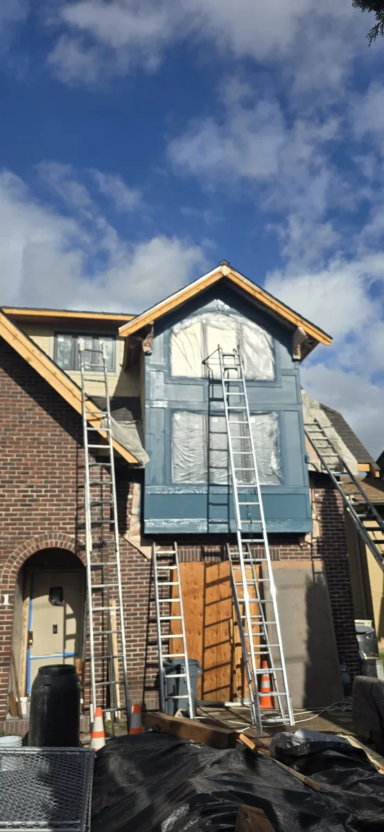 Exterior trim and upper window detail in progress