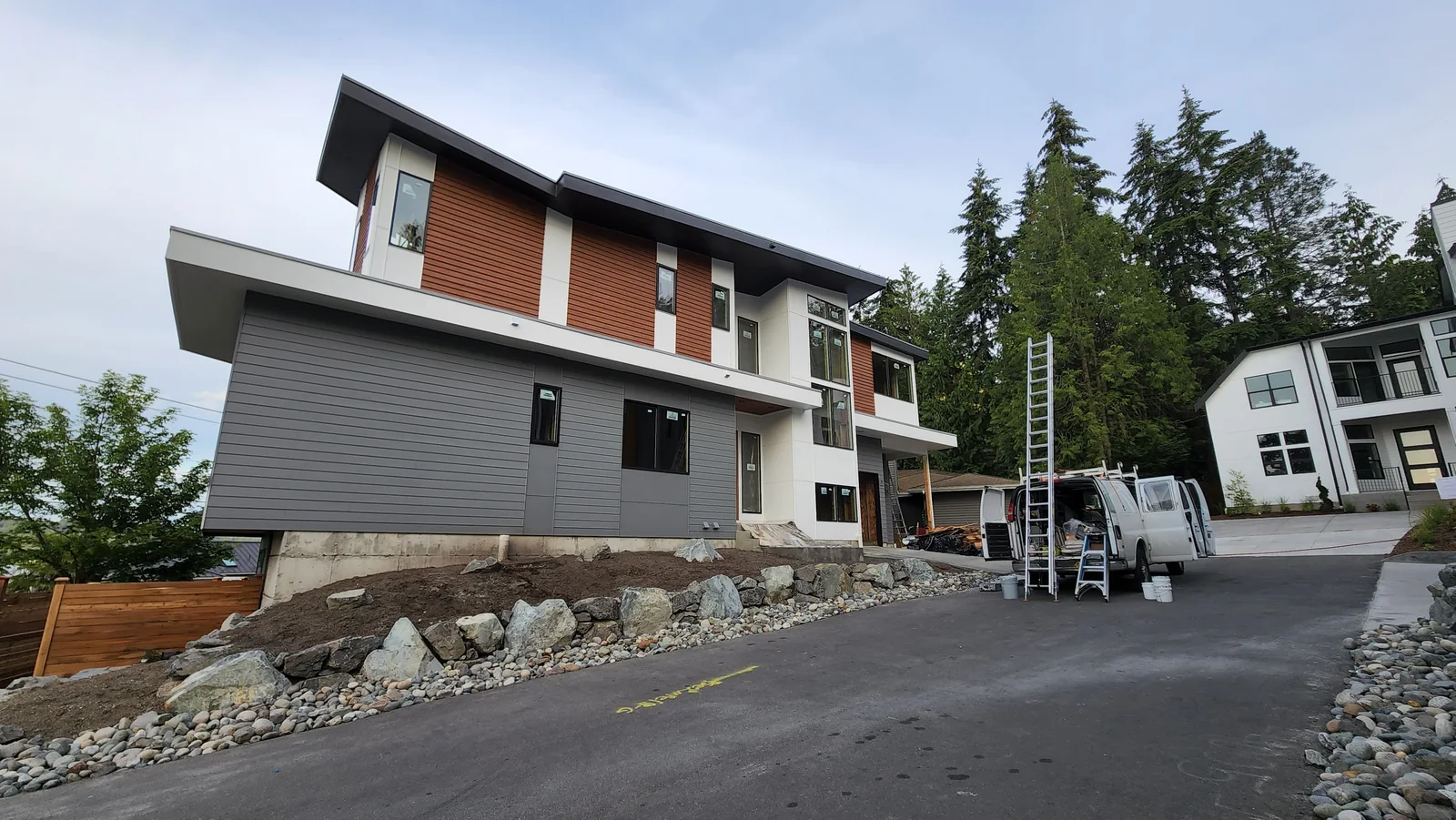 Modern home exterior painting with siding and trim details